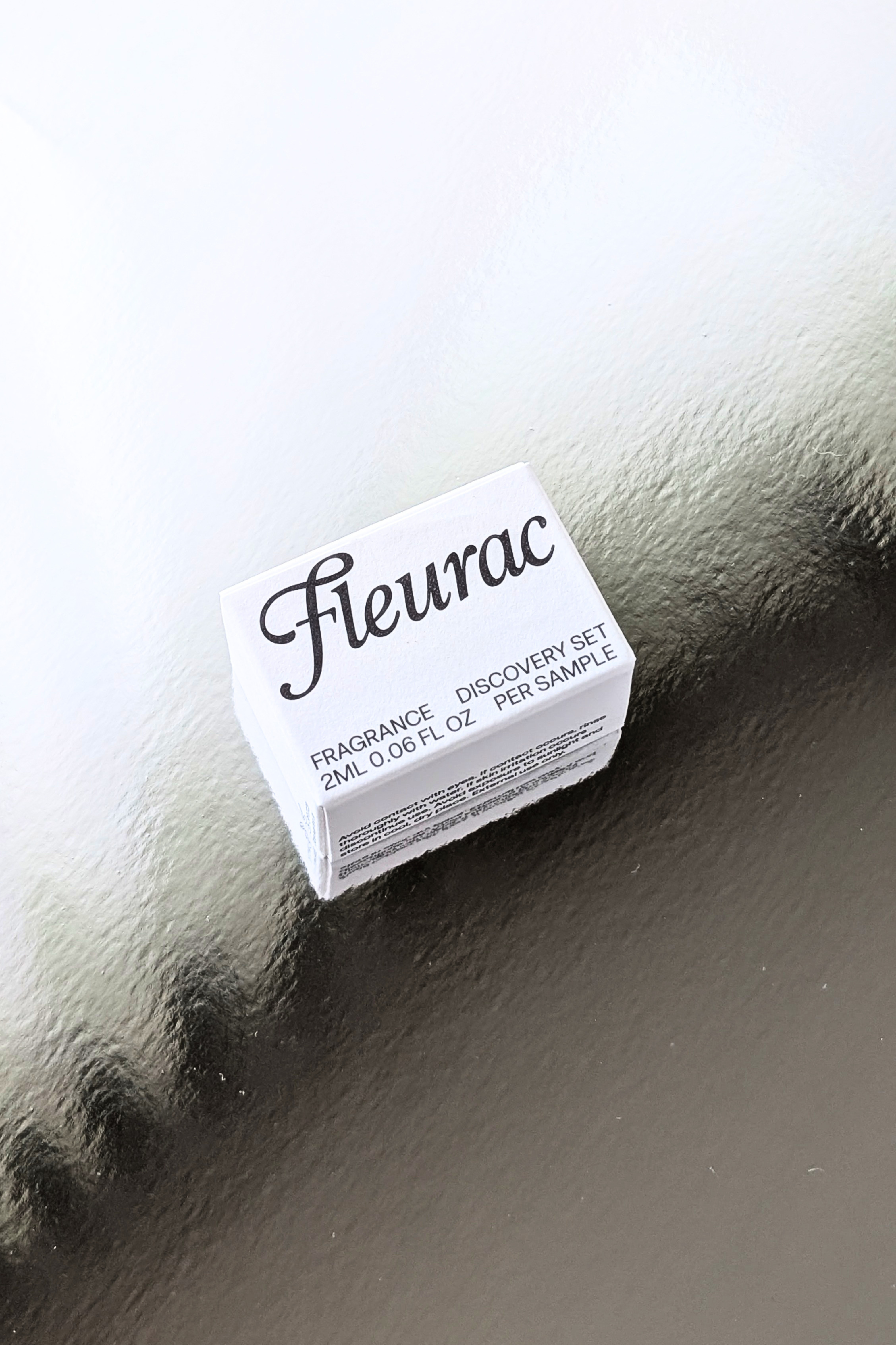 Fleurac Fragrance: Clean Oil Roller Perfume Samples showing a small white box labeled 'Fleurac' with 'Fragrance Discovery Set 2ml / 0.06 fl.